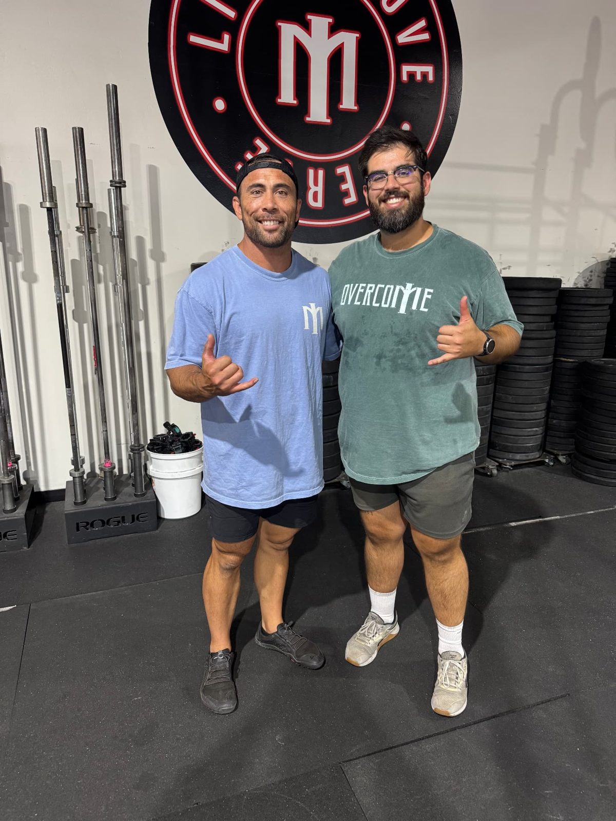 Coaches wearing Overcome shirts